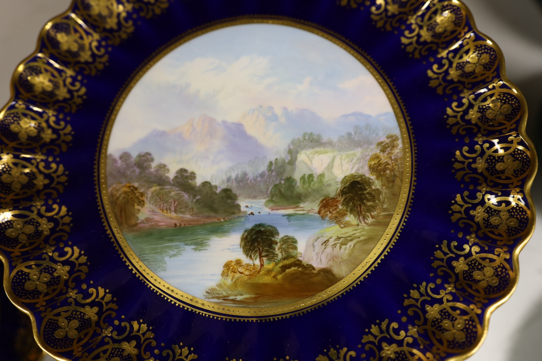 A Copeland Spode blue and gilt decorated topographical dessert service with central titled landscape cartouches, comports 21.5cm diameter. Condition - fair to good